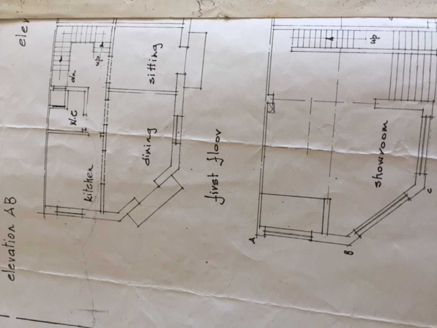 Corner showroom with underlying garage in Paola